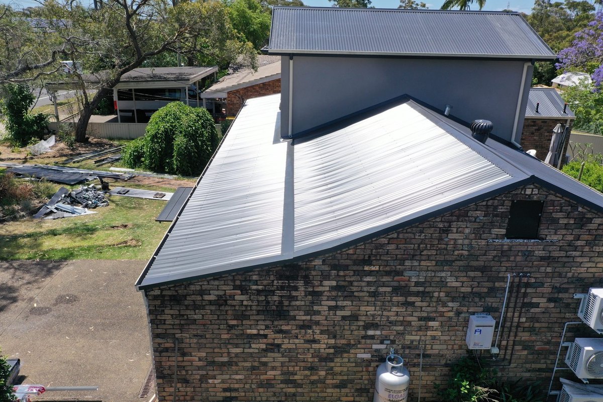 Aerial view of a silver corrugated metal roof